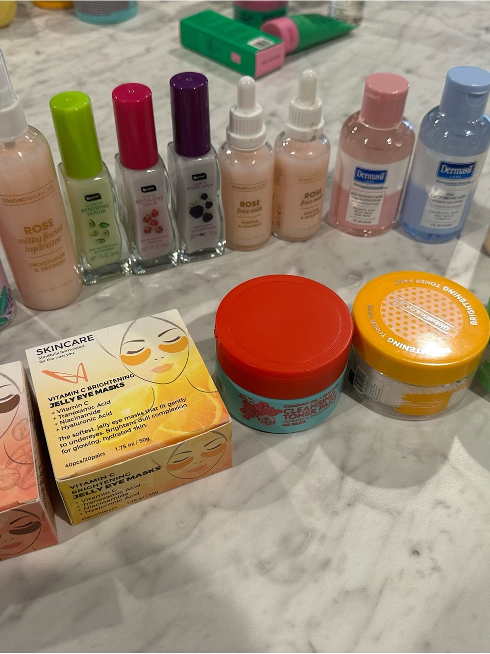 Bundle of facial toner pads, eye masks, and serums